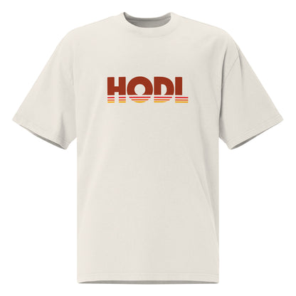 Beige t-shirt with 'HODL' printed on a white background