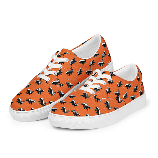 Orange sneakers with black and white honey badger pattern on a white background