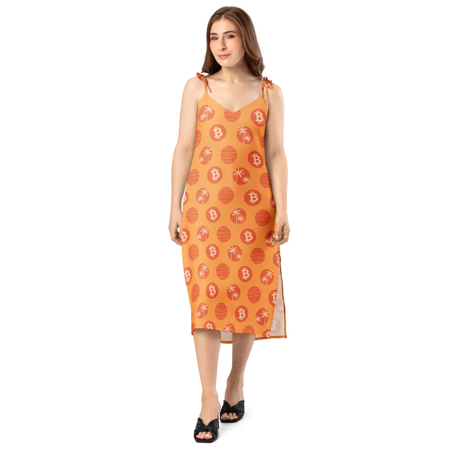 Woman wearing an orange dress with tropical bitcoin patterns and text on a white background