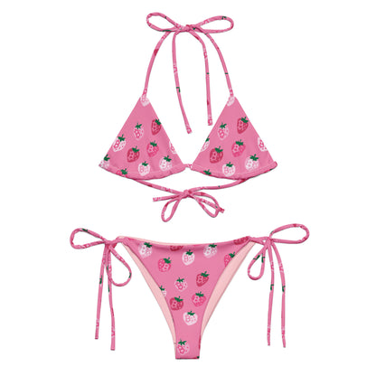Pink bikini set with strawberry bitcoin pattern on a white background