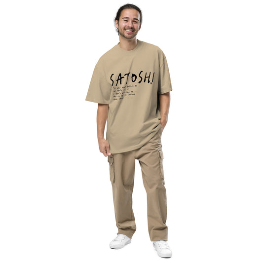Man wearing a beige t-shirt with 'Satoshi' text on a white background