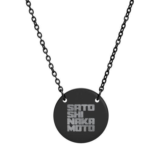 Black necklace with a round pendant featuring engraved satoshi nakamoto text on a white background