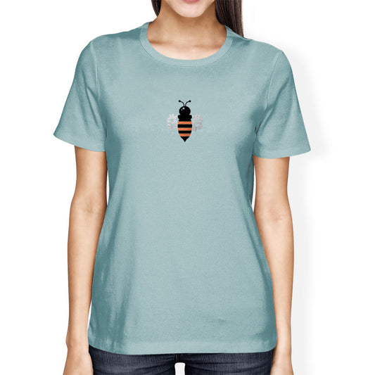 Person wearing a light blue t-shirt with a bee bitcoin design on a white background