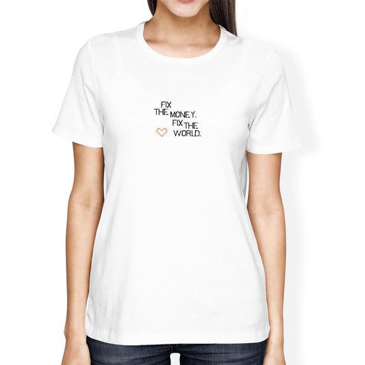 White t-shirt with text 'Fix the money, fix the world' worn by a person on a white background