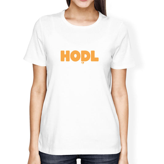 Person wearing a white t-shirt with 'HODL' printed in orange on a white background